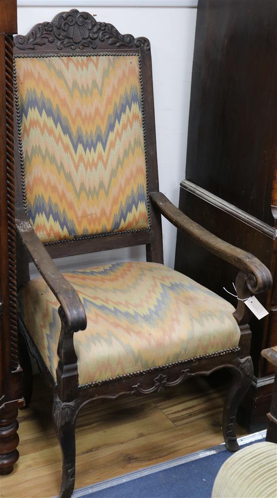 An 18th century French oak elbow chair